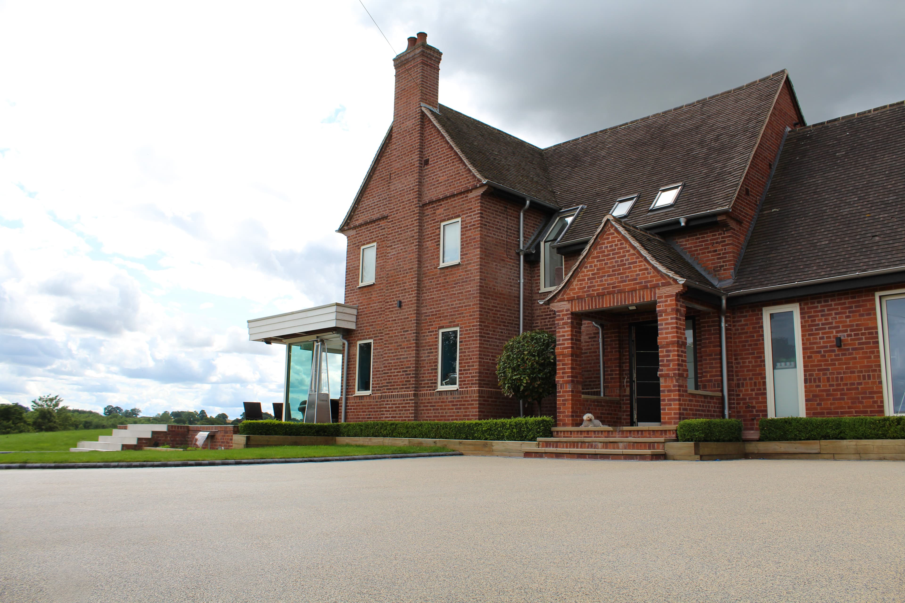 Premium resin-bound driveway installed outside a large home